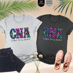a pair of t - shirts with the word gap printed on them