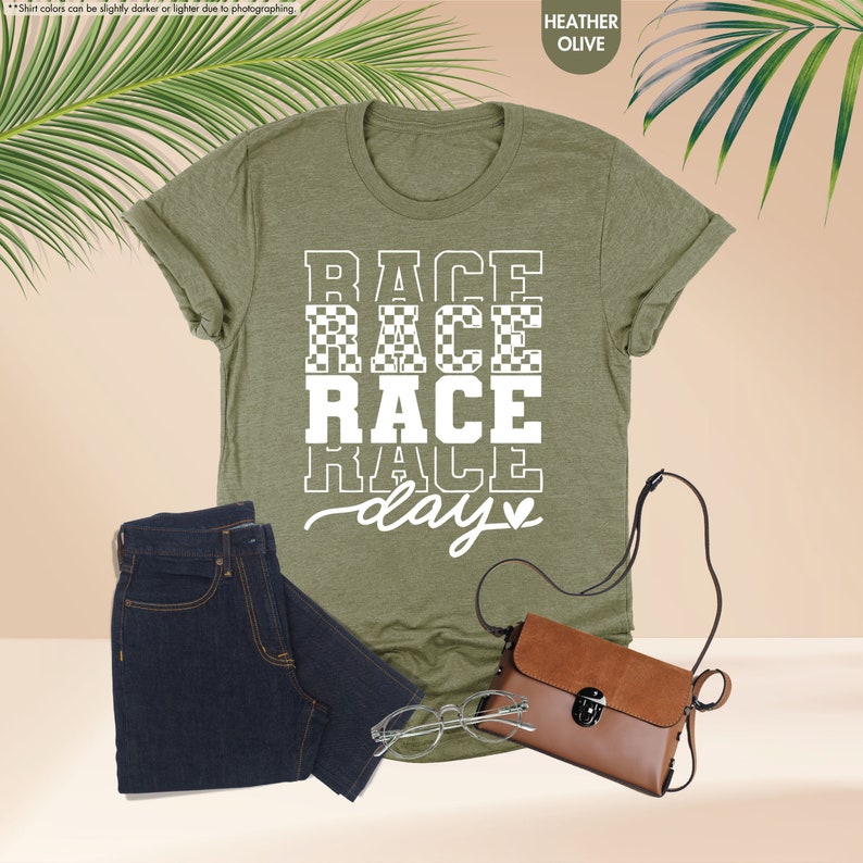 a t - shirt with the words race race and a purse next to it