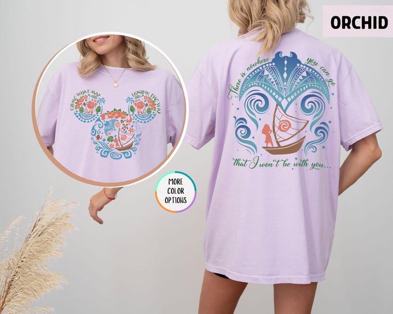 May include: Purple t-shirt with a graphic of a boat and a girl with the text "There is nowhere you can go that I won't be with you..." on the back and a graphic of Mickey Mouse ears with flowers and a boat on the front.