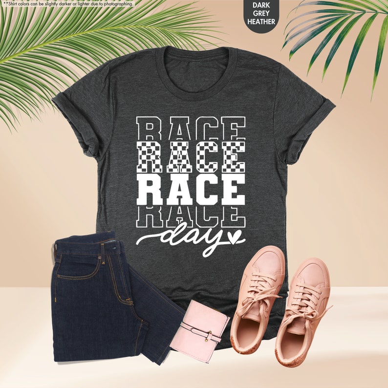 a t - shirt that says race race race days next to a pair of jeans