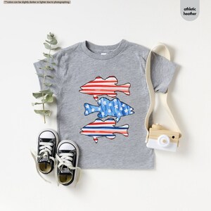 a pair of sneakers and a t - shirt on a table