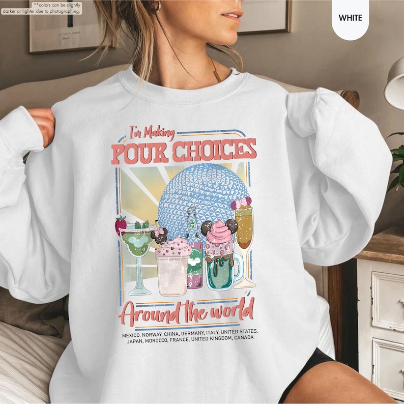 Pu&ograve; includere: Felpa bianca con una grafica colorata che recita "I'm Making Pour Choices Around the World". Il design presenta cocktail e una sfera blu. La felpa &egrave; uno stile casual e confortevole.