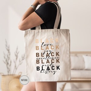 a woman carrying a black tote bag