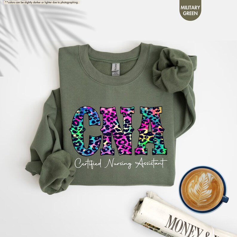 a green shirt with a leopard print on it and a cup of coffee next to