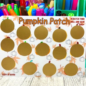 May include: A white card with the text "Pumpkin Patch" and scratch-off pumpkin shapes. The card also includes the text "SCRATCH THEN ROLL AND SAVE $50+" and "LADY DI SAVES". The background features fall leaves and small pumpkin illustrations.