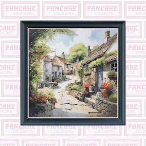 Puede incluir: Una pintura de una pintoresca calle de un pueblo con casas de piedra, flores rojas y un camino empedrado. Las casas tienen techos marrones y paredes blancas. La pintura está enmarcada en un marco negro.