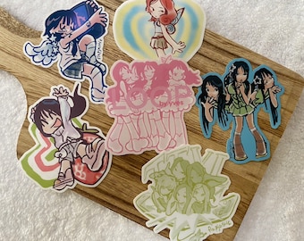May include: A set of ten colorful stickers featuring anime-style girls with different poses and expressions. The stickers are printed on a white background with a glossy finish. The stickers are perfect for decorating laptops, water bottles, notebooks, and other personal items.