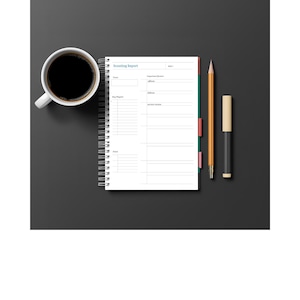 May include: A top-down view of a workspace featuring a white spiral-bound notebook with the text "Scouting Report", a cup of black coffee, a pencil, and a pen. The notebook has color-coded tabs. The items are arranged on a dark gray surface.