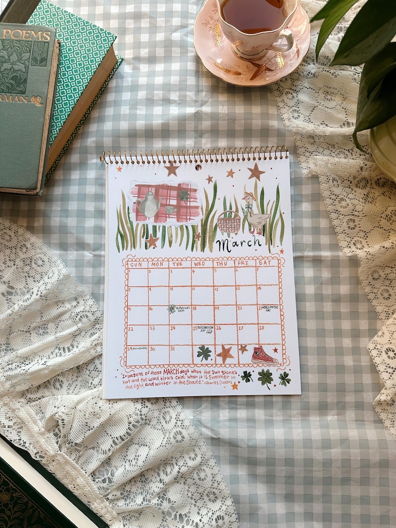 Scrips & Scraps 2026 Calendar Featuring; Paper cutouts, cozy quotes, bookish holidays, and classic foods!