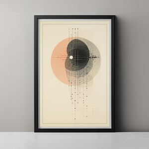 Könnte beinhalten: Abstrakter Kunstdruck mit einem schwarzen und weißen Kreis mit einem kleineren weißen Kreis in der Mitte, umgeben von einem größeren pfirsichfarbenen Kreis. Die Kreise bestehen aus überlappenden Linien und Punkten, die ein geometrisches Muster bilden. Der Druck ist in einem schwarzen Rahmen gerahmt.