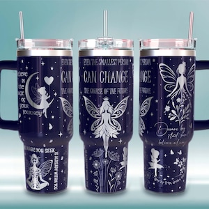 May include: Three navy blue insulated tumblers with silver fairy and inspirational text designs. Each tumbler has a handle, a clear lid, and a silver straw. The text includes phrases like "Believe in the magic you seek" and "Even the smallest person can change the course of the future."