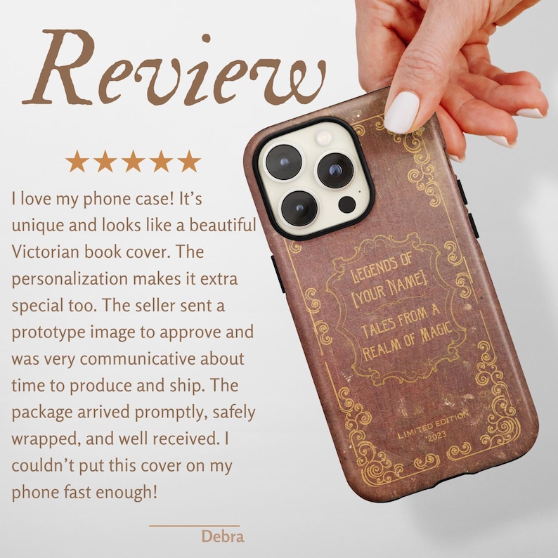 May include: A brown phone case with a vintage book cover design, featuring the text "LEGENDS OF [YOUR NAME] TALES FROM A REALM OF MAGIC" and "LIMITED EDITION 2023". The case is held by a hand.