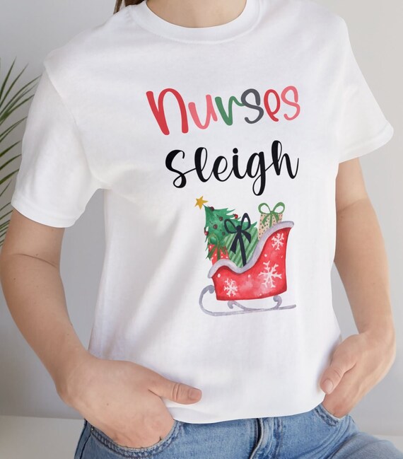Medical Scrub Top Nurse's Hat Wearing Snowman Xmas Funny T-Shirt Medical Scrub Top Nurse's Hat Wearing Snowman Xmas Funny T-Shirt