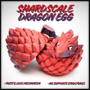 May include: A red and blue dragon egg, split open to reveal a baby dragon. The egg is textured with a scale-like pattern. The text "SHARDSCALE DRAGON EGG" is at the top. The text "-TWIST & LOCK MECHANISM" and "-NO SUPPORTS STRUCTURES" are at the bottom.
