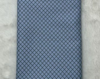 May include: A light blue fabric with a black diamond pattern.