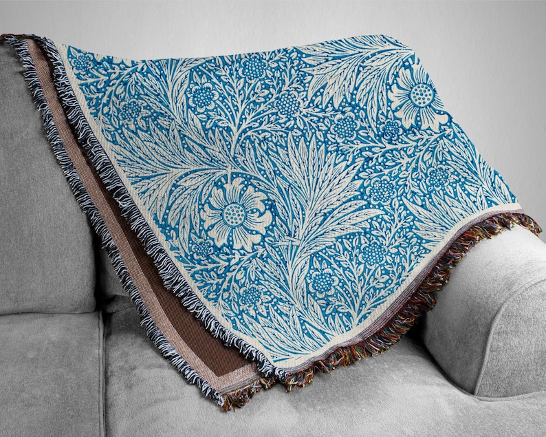 Blue William Morris Woven Blanket Draped over a Grey Couch