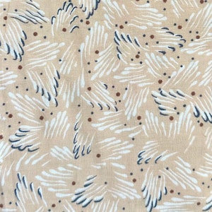 May include: Beige fabric with a white and blue abstract pattern. The pattern features small, white, feather-like shapes with blue outlines. There are also small brown dots scattered throughout the fabric.