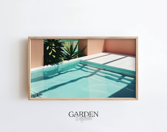 May include: A framed print of a digital illustration of a swimming pool with a peach-colored wall and green plants in the background.