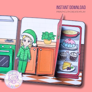Könnte beinhalten: Ein Papierspielset mit einem Mädchen in grüner Pyjama und Hut in einer Küchenszene. Das Set enthält einen Kühlschrank mit Desserts und den Text "INSTANT DOWNLOAD PRINT•CUT•CREATE•PLAY".