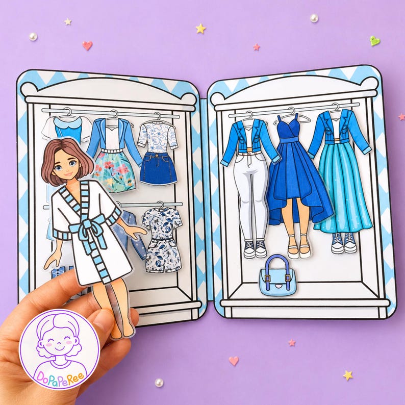 May include: A paper doll set featuring a character in a white robe and a two-door closet filled with various outfits, including blue jackets, skirts, dresses, and pants. The set includes a small blue handbag and a circular logo labeled DoPaPeRee.