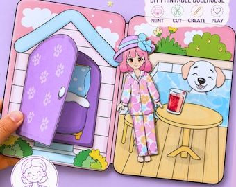 Könnte beinhalten: Ein DIY-Puppenhaus zum Ausdrucken mit einer Papierpuppe in geblümtem Schlafanzug und Hut, einem weißen Welpen, einem runden Tisch mit rotem Getränk und einer lila Tür mit Pfotenabdrücken. Text: DIY PRINTABLE DOLLHOUSE PRINT CUT CREATE PLAY.