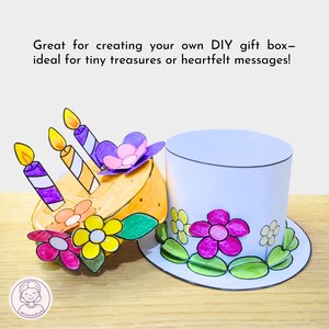 Puede incluir: Una caja de regalo DIY con un dise&ntilde;o de sombrero de copa blanco, adornada con flores de papel de colores y hojas verdes. Una tarta de papel con velas y flores est&aacute; al lado del sombrero. El texto dice: "Great for creating your own DIY gift box- ideal for tiny treasures or heartfelt messages!"