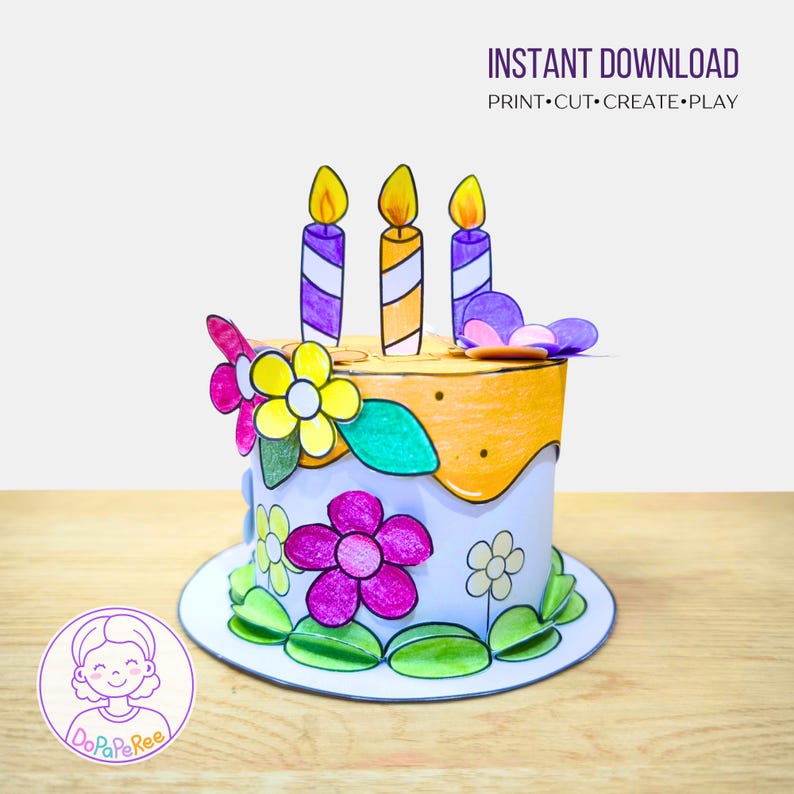 Puede incluir: Una tarta de cumplea&ntilde;os de papel con tres velas y flores coloridas. La tarta tiene una base blanca con glaseado naranja y est&aacute; decorada con flores moradas, amarillas y rosas. El texto "INSTANT DOWNLOAD" est&aacute; en la parte superior.