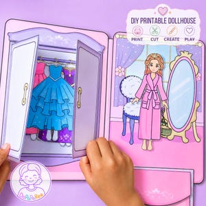 May include: A DIY printable dollhouse set featuring a paper doll in a pink robe, a wardrobe with blue and purple dresses, a chair, and a mirror. The top right corner includes the text DIY PRINTABLE DOLLHOUSE with icons for print, cut, create, and play.