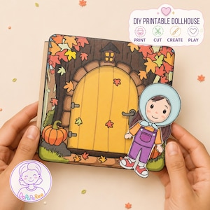May include: A DIY printable dollhouse kit featuring a square card with a yellow door, autumn leaves, and a pumpkin. A paper doll character wearing a light blue bonnet, orange shirt, and purple overalls is attached. Text reads DIY PRINTABLE DOLLHOUSE.