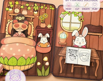 May include: A DIY printable dollhouse set featuring a two-page illustrated scene. The left side shows a character in bed with a sleep mask, and the right side shows a rabbit at a desk with a coloring book. Text reads DIY PRINTABLE DOLLHOUSE.