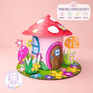 May include: A printable paper activity featuring a colorful mushroom-shaped house with a red roof, a brown door, and blue windows. The scene includes paper flowers, green grass, and a smaller orange mushroom, all set on a circular base with text reading PRINTABLE PAPER ACTIVITY.