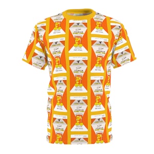May include: A short-sleeved, yellow and orange t-shirt with a repeating pattern of a drink in a glass with lemons. The text "PREMIUM" and "PINT 473mL" is visible on the design.