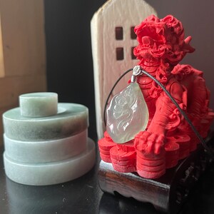 One of the kind, unique translucent green jade with flower carving pendant