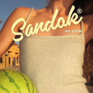 May include: A light green knitted tank top with thin straps. The top is labelled "Sandak" with the number "026 08". The image also shows a watermelon and the text "TANK TOP SIZE XS-XXL".