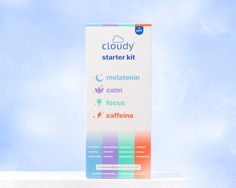 May include: A blue and white box with the text "cloudy starter kit" and images of a moon, flower, lightbulb, and lightning bolt. The box contains four aroma diffusers with botanicals, including melatonin, lavender, chamomile, ashwagandha, jasmine, natural mint, mango, and vitamin B12. The box states that there are 2,400 uses in total.