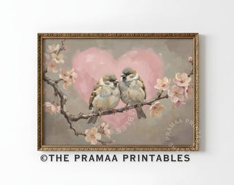May include: A framed print featuring two sparrows perched on a flowering branch, set against a soft pink heart and a muted gray background. The artwork has a vintage aesthetic, with the text "© THE PRAMAA PRINTABLES" at the bottom.