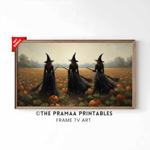 May include: A framed print featuring three witches in black dresses and hats, holding brooms, walking through a pumpkin patch. The artwork has a warm, autumnal color palette with pumpkins and foliage. The text "THE PRAMAA PRINTABLES FRAME TV ART" is at the bottom.