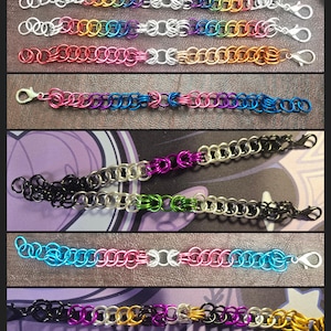 May include: A collection of colorful chainmail bracelets. Each bracelet is made of small, interlocking metal rings in various colors, including silver, gold, red, pink, blue, and purple. The bracelets have a lobster clasp closure.