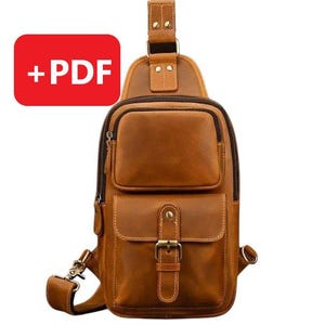 May include: A brown leather crossbody bag with a buckle closure and a zippered pocket on the front. The bag has a strap that can be adjusted to fit comfortably on the shoulder.