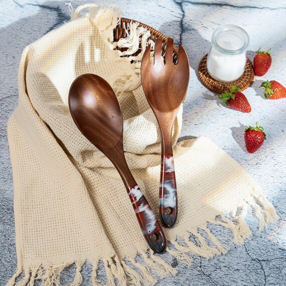 Wood-and-resin serving spoons with swirling color inlays — each one is literally one-of-a-kind and looks like jewelry for your kitchen drawer.