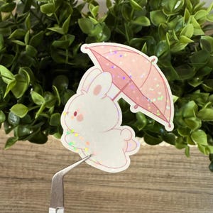 Sticker Niedlicher Hase mit Regenschirm | Holografischer Glitzersticker | Kawaii Bunny Aufkleber für Bullet Journal, Laptop