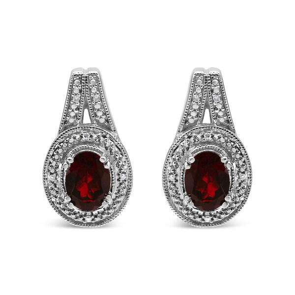 The .925 Sterling Silver Diamond Accent and 8x6mm Red Oval Garnet Stud Earrings (I-J Color, I1-I2 Clarity)