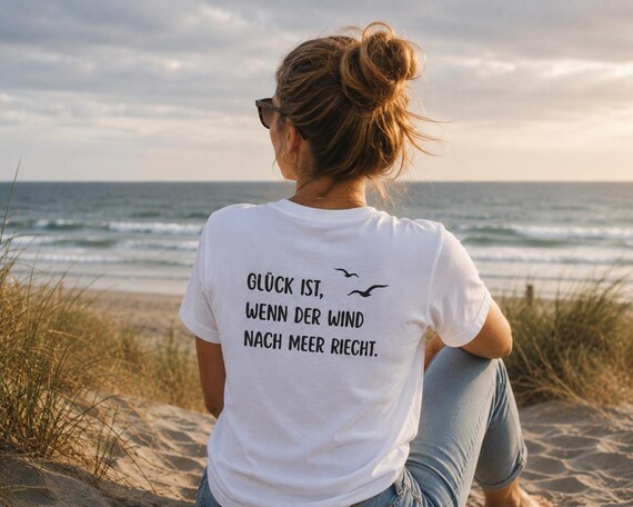 Unisex T-shirt with seagull, lighthouse, and anchor design, featuring a back print and slogan; 100% cotton coastal shirt