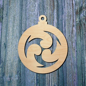 May include: A wooden ornament in the shape of a Christmas ball with a decorative cutout design. The ornament is made of light-colored wood and has a loop at the top for hanging. The design features a swirling pattern.