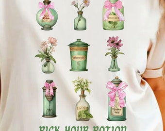 May include: Cream-colored t-shirt featuring a watercolor design of potion bottles and vases with flowers, tied with pink ribbons. The text "Pick Your Potion" is printed in green below the design. The shirt has short sleeves.