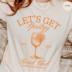 Personalized Bachelorette Tee, Let&#39;s Get Spritzy Personalized T-Shirt, Aperol Spritz Bachelorette Orange Matching Custom Girls Trip Bach Top