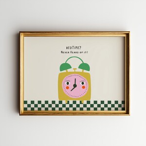 May include: A framed wall art print featuring a yellow alarm clock with a pink face, green bells, and a face with eyes and cheeks. The text reads BEDTIME? NEVER HEARD OF IT! The bottom border features a green and white checkered pattern.