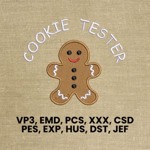 May include: Embroidered design featuring a gingerbread man with a smiling face and the text "COOKIE TESTER" above. The gingerbread man is brown with black dot eyes and buttons, and white icing details. The image also includes embroidery file formats.