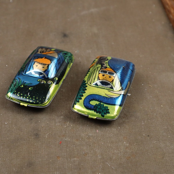 Two old cars, sheet metal toys