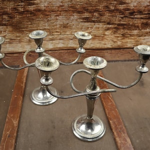 Two Curved Metal candle holder for three condles!